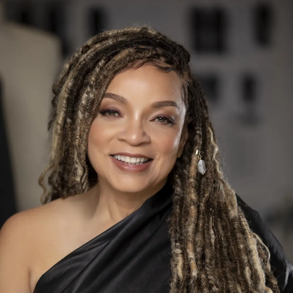 Ruth E Carter wearing a black store